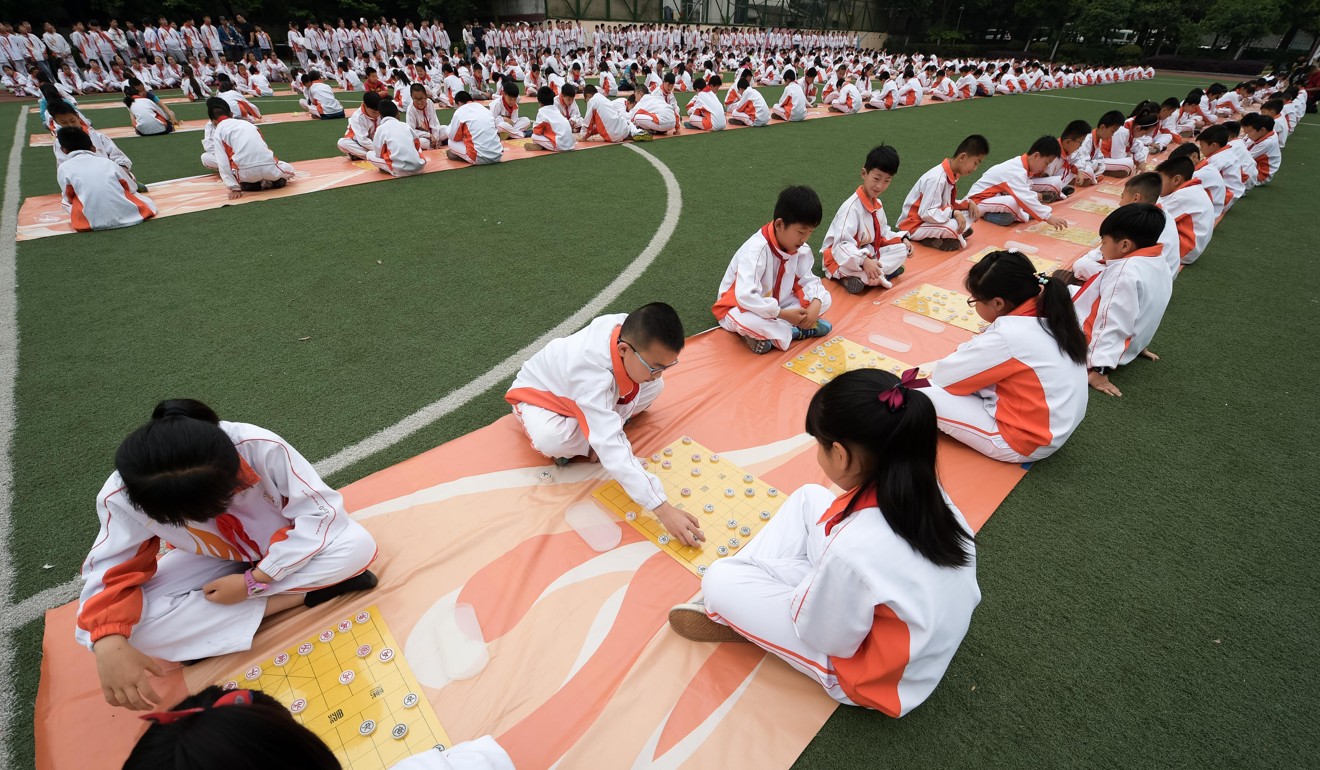 033 Pupils compete in a Chinese chess contest during the Chinese chess cultural festival at Gedadian Primary School in Hefei capital of east Chinas Anhui Province