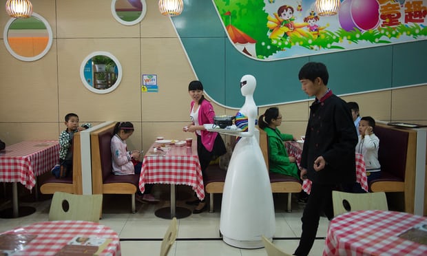 a robot waiter makes her rounds in Kunshan in 2016