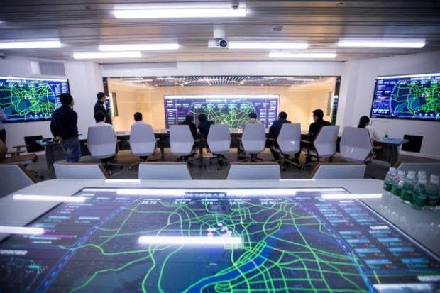 Screens showing traffic data of Hangzhou city are seen during a media tour of City Brain an AI powered traffic management system by Alibaba Cloud in Hangzhou