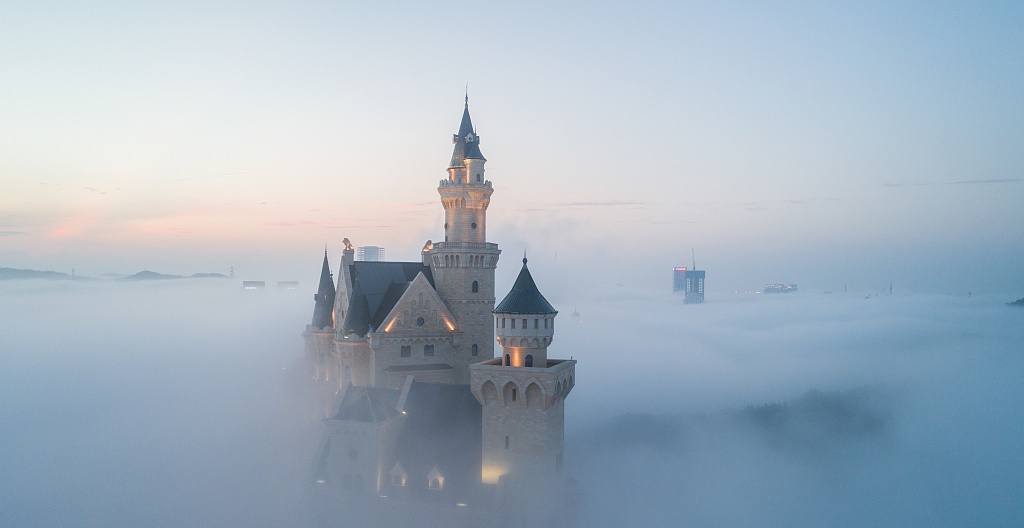 A castle rises above the mist in a beautiful scene in Dalian Liaoning province