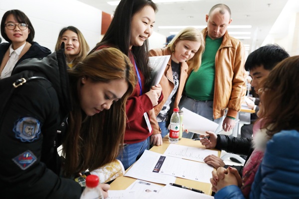 Foreign students attend a job fair at Zhongguancun high tech zone in Beijing