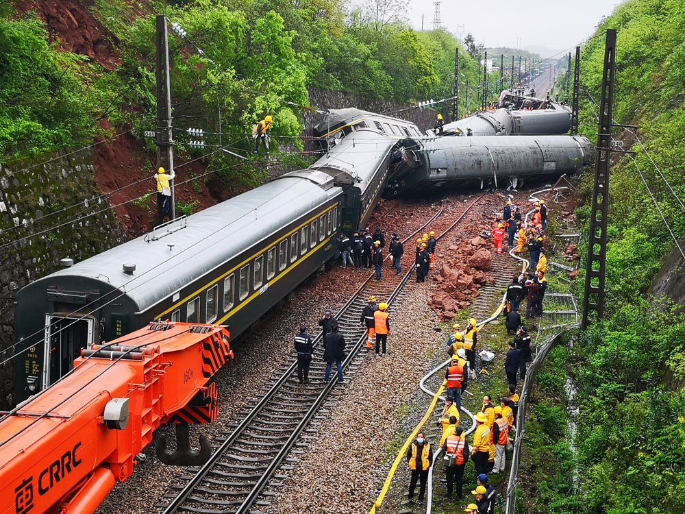 Resuers work at the scene after a passenger train derails in Chenzhou city of Central Chinas Hunan province on March 30 2020