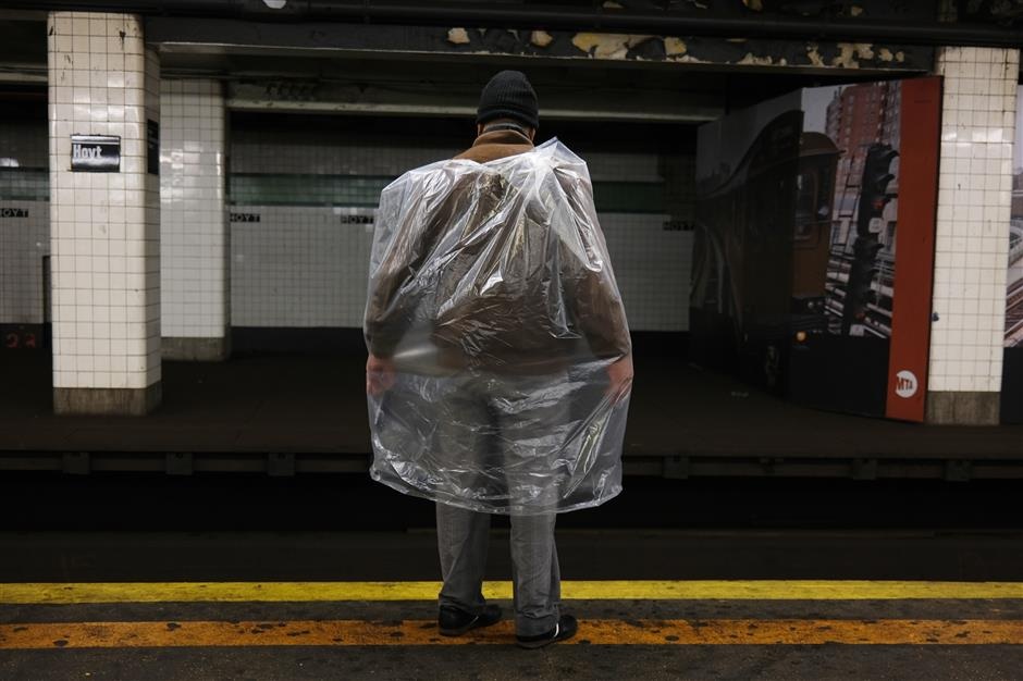 A man waits for a train in a subway station during the coronavirus outbreak on April 13 in New York City