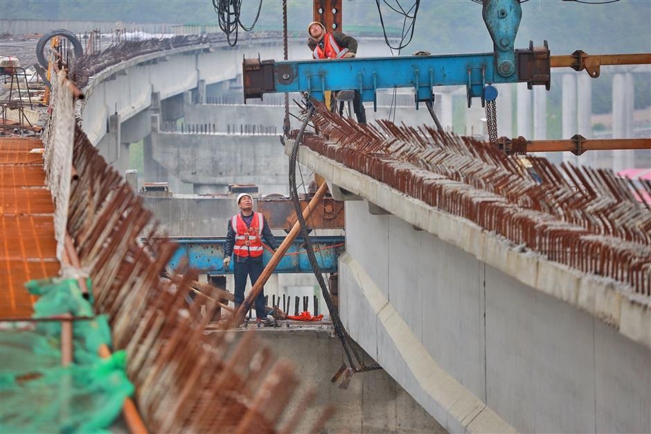 Workers at the construction site of an expressway in Anshun Guizhou Province