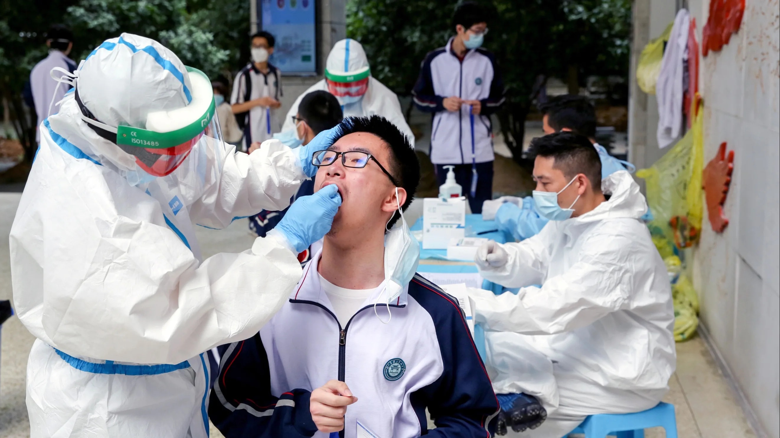 High school students in Wuhan take virus tests on April 30 before returning to school in early May