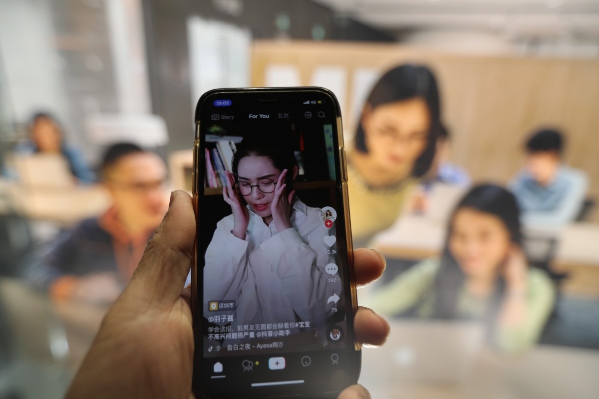 A smartphone shows live streaming of Douyin also known as TikTok