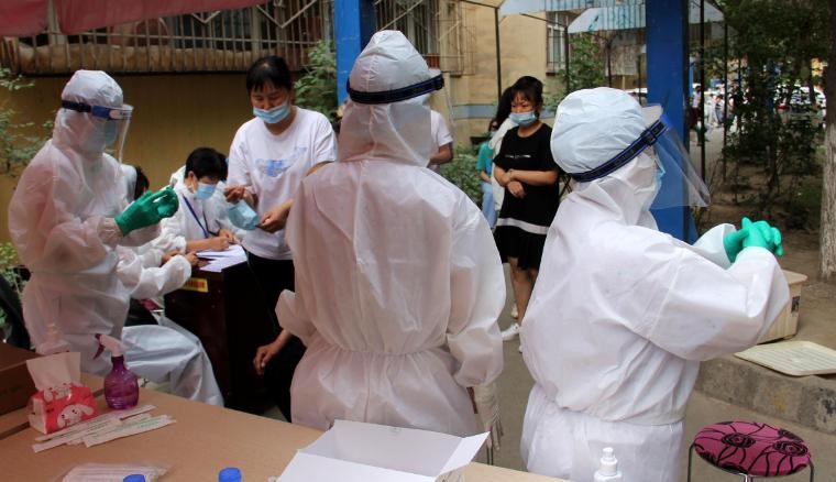 Residents undergo testing for the coronavirus on July 19 in Urumqi