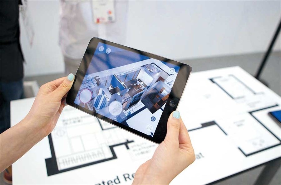 An exhibitor demonstrates an augmented reality application at the Mobile World Congress Shanghai