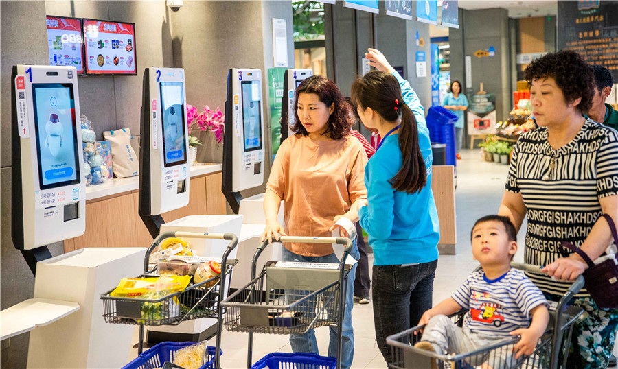 Customers use self service checkout machines at Alibabas Hema Fresh supermarket in Shanghai