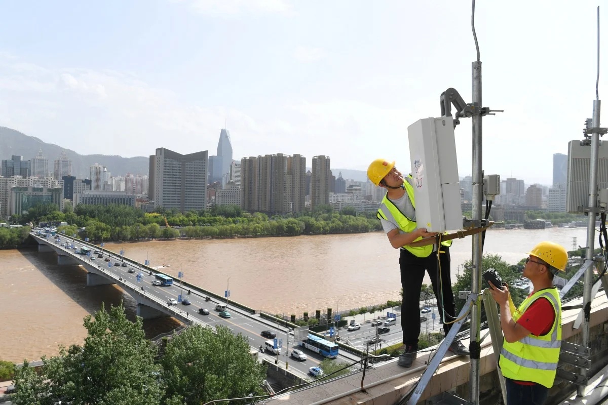 China Telecom technicians test an equipment at the 5G network base station near Yellow River in Lanzhou Gansu province China on May 16 2019